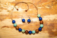 Load image into Gallery viewer, Blue, Red and Green Tagua Nut Adjustable Necklace and Earrings set (Click to see other colors)