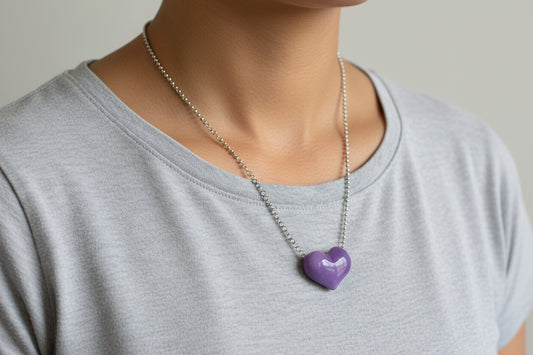 Purple heart-shaped tagua pendant on a silver chain 
