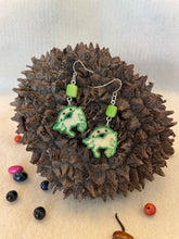 Load image into Gallery viewer, Green Tagua Nut Horseshoe Derby Earrings
