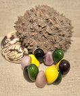 Load image into Gallery viewer, Handmade Teardrop Tagua Nut Stretch Bracelet – Eco-Friendly Vibrant Jewelry
