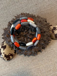 Load image into Gallery viewer, Handmade Tagua Nut Memory Wire Bracelet – Black, Gray, White & Orange
