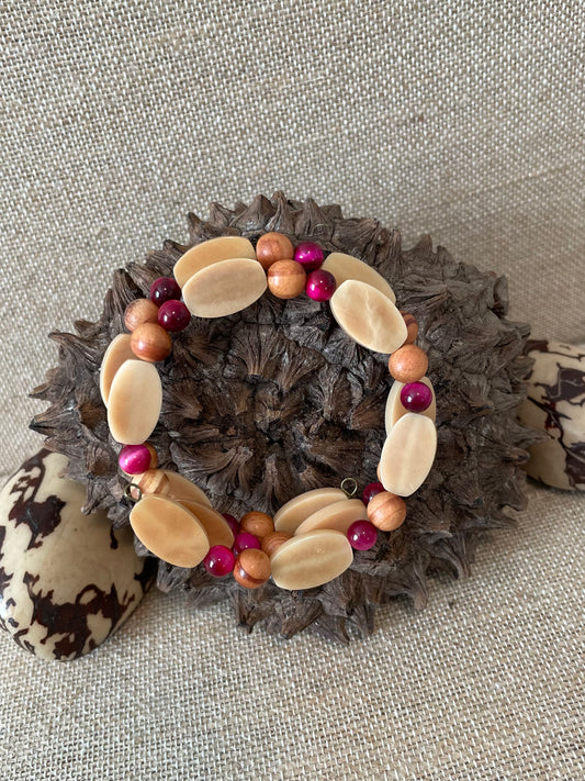 tagua nut memory wire bracelet in ivory and hot pink colors,